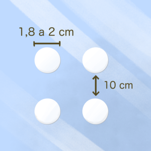 Adesivos circulares aplicados no vidro a cada 10x10 cm